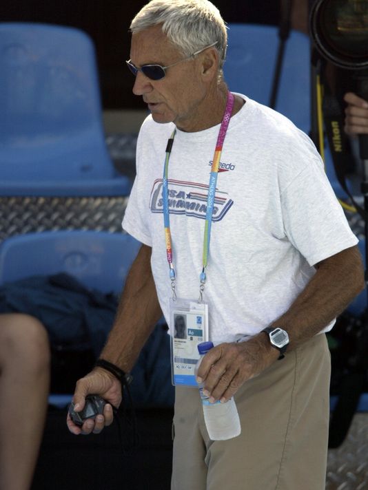 Coach Jon with watch on pool deck